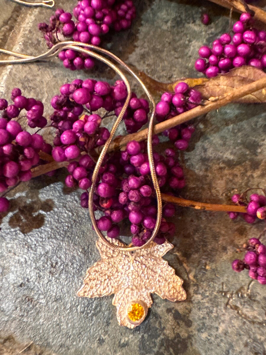 Fall Maple leaf in Fine Silver accented with simulated gemstone on 18” Silver snake chain with lobster clasp $125.00
